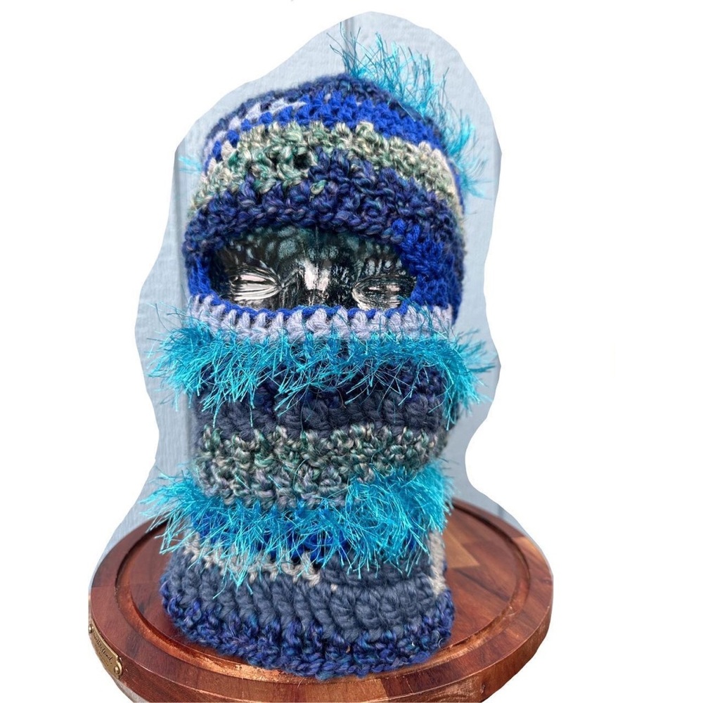 Unique array of blue textured yarns to crate this fun sea like mask